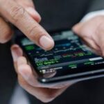 A person using mobile to check stock market