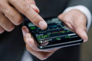 A person using mobile to check stock market